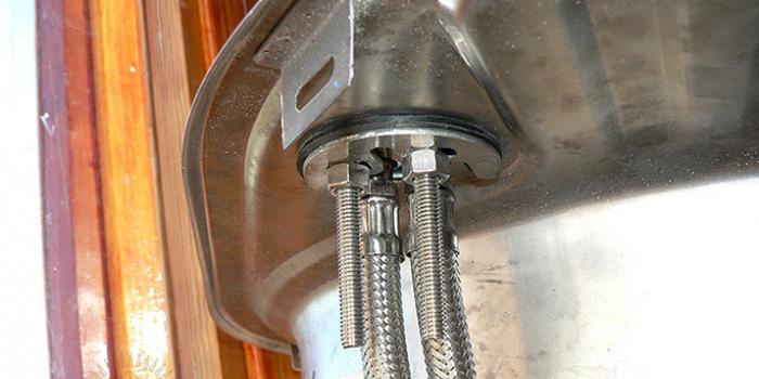 Step-by-step instructions for installing a faucet on a kitchen sink